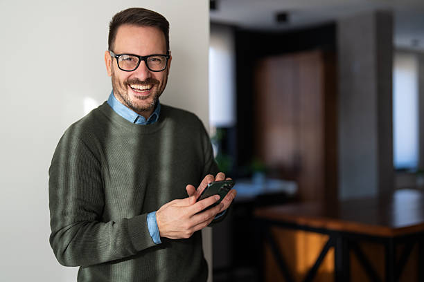 istock Man using smartphone and laptop computer for electronic banking, making reservation, online shopping 2250650538