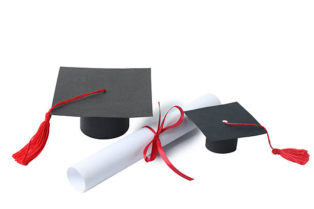 istock Graduation concept. Flat lay square academic cap with diploma and book on white background. 2250651772