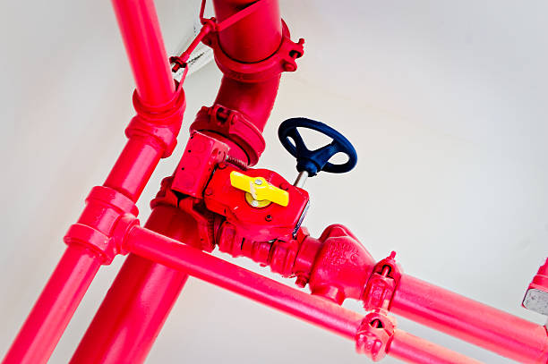 istock Fire Sprinkler System Valve Close-up Red Pipework Commercial Safety 2250651815