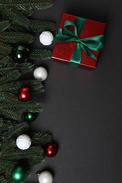 istock Christmas gift. Top view of image on black background with space for decoration. 2250652103