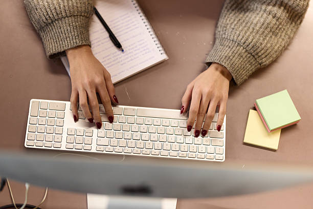 istock Above view of a female programmer working on PC in the office. 2250653244