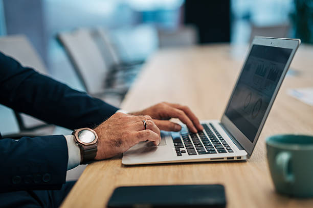 istock Business professional typing on laptop analyzing data in office 2250653699