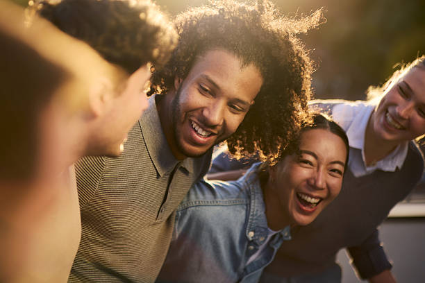 istock Cheerful friends walking embraced in nature. 2250653806