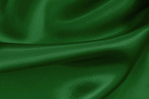 istock Dark green fabric cloth texture for background and design art work, beautiful crumpled pattern of silk or linen. 2250654734