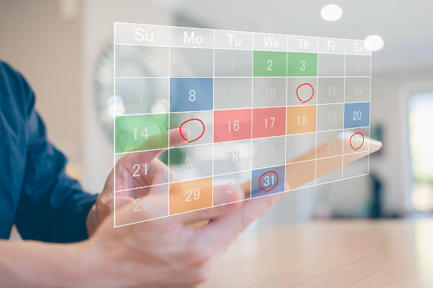 istock Hand using tablet with digital calendar and highlighted dates for planning, task management, scheduling, booking, deadline reminder and time organization in business or personal events 2250655684