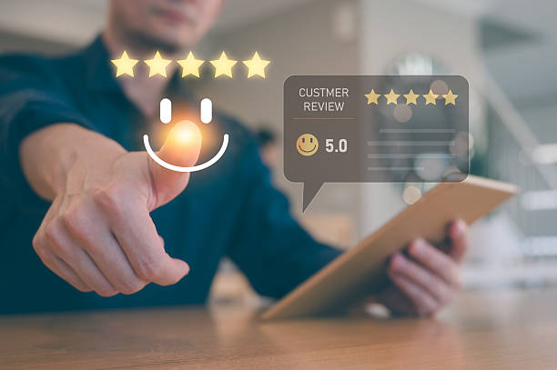 istock feedback and Customer service satisfaction survey concept.Businessman, customers show satisfaction by pressing tick mark on happy smile face five star bar in satisfaction on virtual touch screen 2250655745