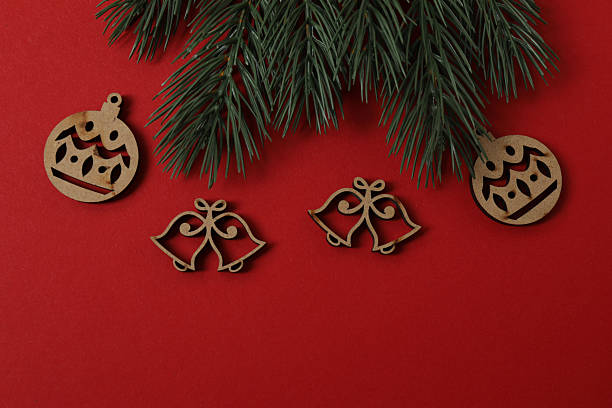 istock Christmas gift. Top view of a Christmas tree image on a red background with space for decoration. 2250655757