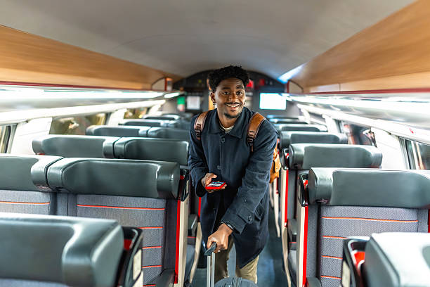 istock Young man traveling by train for business trip 2250656724
