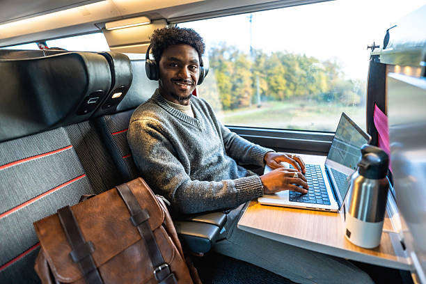 istock Man working on laptop during train business trip 2250656854