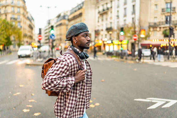 istock Young black man walking urban paris street 2250657631