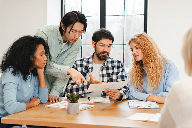 istock Diverse business team collaborating during office meeting, discussing paperwork 2250663573