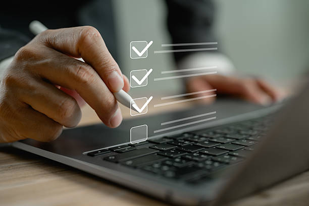 istock Business performance checklist, businessman using laptop doing online checklist survey, filling out digital form checklist, take an assessment, questionnaire, evaluation, online survey, online exam. 2250663641