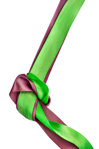 Tied green and maroon color satin ribbons isolated on white background