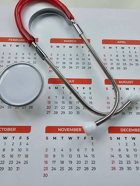 istock Calendar with stethoscope resting on it showing months and dates for planning appointments 2250672479