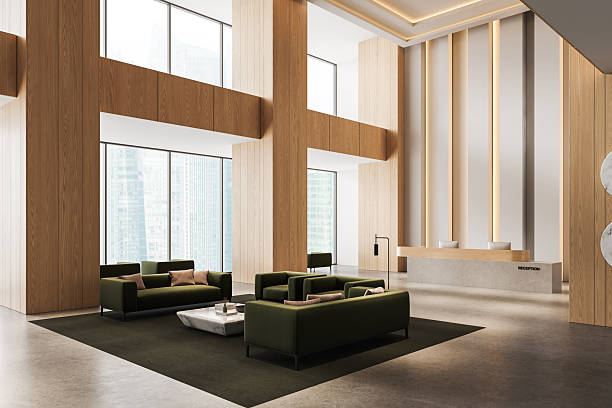 istock Modern hotel lobby interior with minimalist green seating, large windows, wood panel walls, and a sleek concrete reception desk. 3D Rendering. 3D Rendering 2250677877