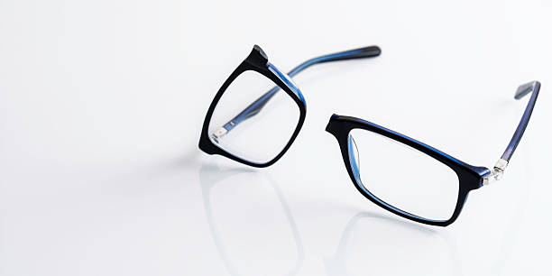istock Broken eyeglasses on glossy white surface highlight need for repair service, careful vision care and timely replacement. 2250677925