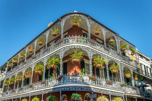 istock NOLA architecture, brick wall building with balconies and intricate ironwork columns in a street of the French Quarter, New Orleans, Louisiana 2250679541