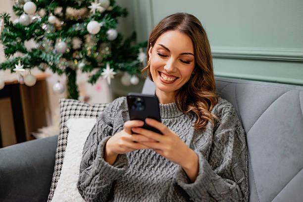 istock Cheerful woman texting on smartphone 2250679600