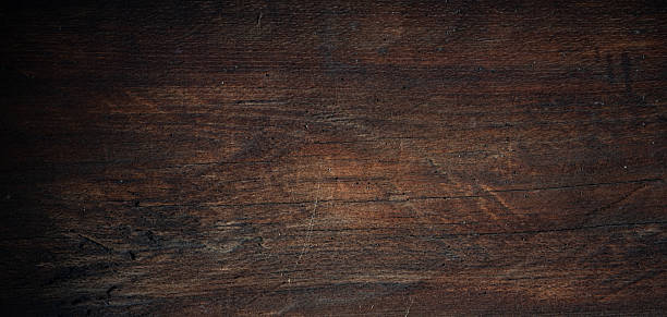 istock Dark rustic wooden background with scratches, grain and subtle texture — suitable as moody backdrop. 2250679697