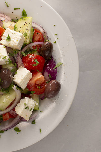 istock Richly flavored Greek inspired salad served on rustic marble surface 2250679809