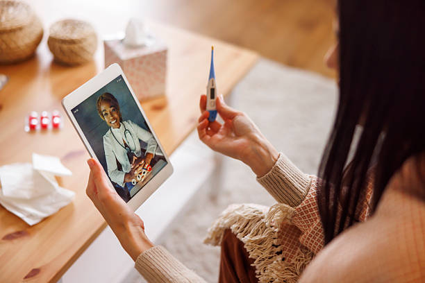 istock Sick woman having online doctor's appointment 2250680194