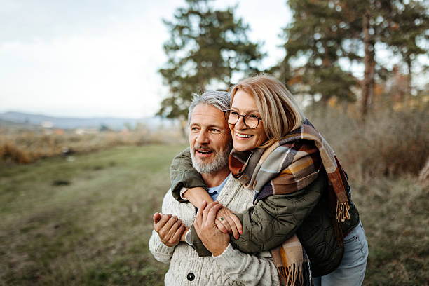 istock Mature couple hugging outdoors in nature 2250682965