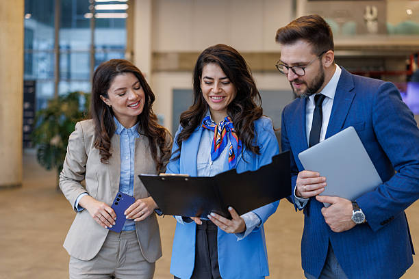 istock Business colleagues reviewing document, discussing corporate strategy and teamwork 2250683082