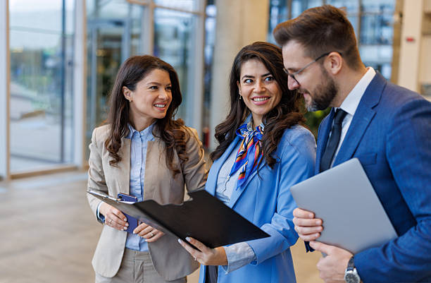 istock Business people planning together, smiling and working collaboratively 2250683084