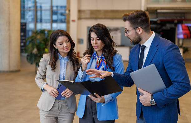 istock Business colleagues collaborating during a corporate office meeting 2250683104