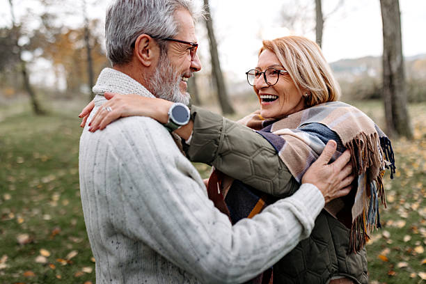 istock Mature couple standing and embracing in nature 2250683107