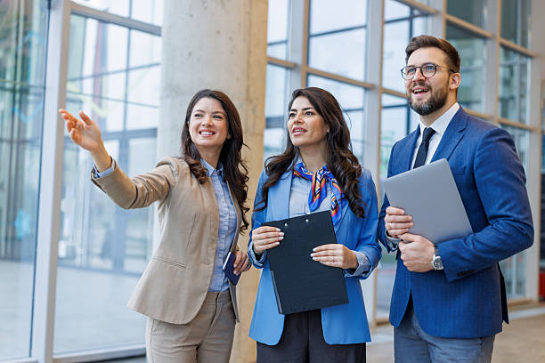 Real estate agents showing property to potential client