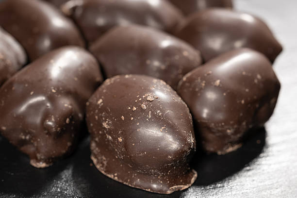 istock Large dark chocolate candies on dark background 2250684223