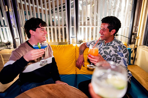 istock Friends talking and drinking cocktail on bar 2250684487