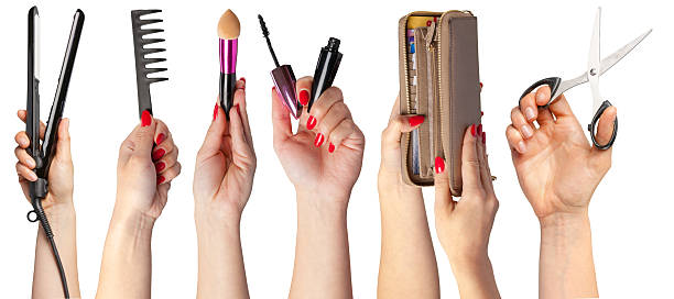 istock Hands with red nails showcase various beauty tools and accessories for grooming 2250684638