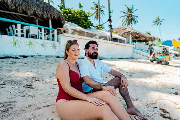 istock Couple looking at view on the beach 2250687791