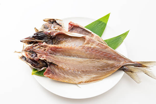 istock Dried horse mackerel on a plate on a white background 2250688219