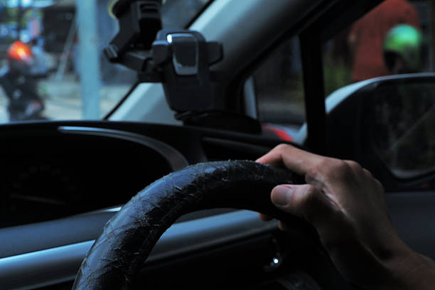 istock Driving Concept: Hands on Car Controls Detail Shot 2250689454