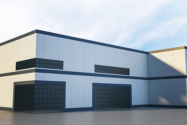 Modern industrial building facade with blue accents and large dark windows, outdoors under daylight, on a clear background. 3D Rendering