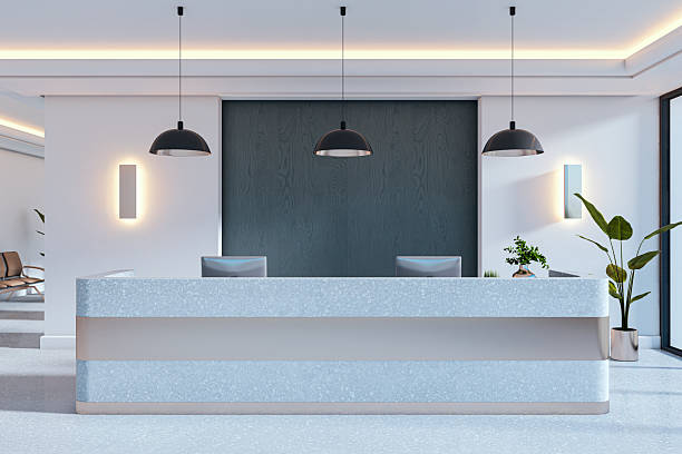 istock Modern clean reception desk in a corporate office interior with plants, pendant lights, and space for branding or mockup template. 3D Rendering 2250690393