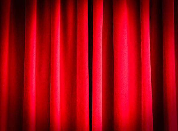 istock Close-up of red closed curtains as background 2250691840