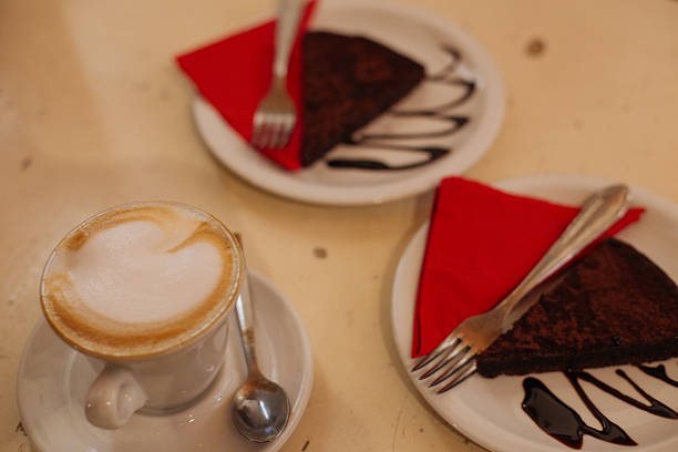 Cappuccino and chocolate cake at the cafe in Italy