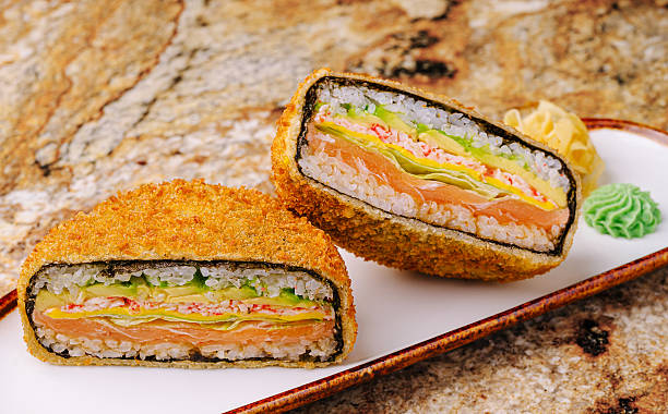 istock Delicious fried sandwich sushi roll filled with fresh ingredients on a plate 2250693950