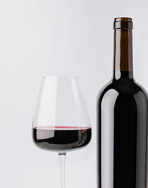 istock Quality red wine served in a glass beside a bottle 2250694238