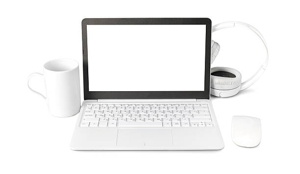 istock Modern workspace setup with laptop, headphones, mug, and mouse on a clean white background 2250696620