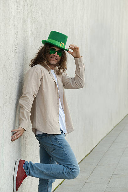 istock Man Wearing Shamrock Glasses and Green St. Patrick's Hat 2250697944