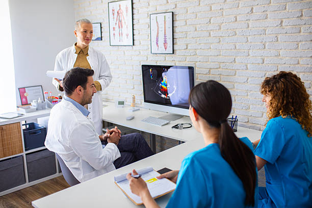 istock Medical Team Having a Discussion in Modern Clinic 2250700355