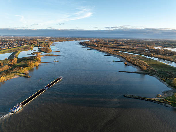 istock Ship on the river Waal during autumn sunrsie seen from above 2250701771