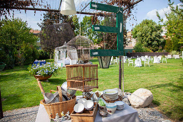 istock Decorative birdcages, plates, and bowls creating an eclectic display at an outdoor event 2250702772