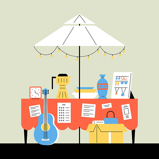 Outdoor Market Booth with Assorted Goods and Umbrella. Flea market. Second-hand goods sales