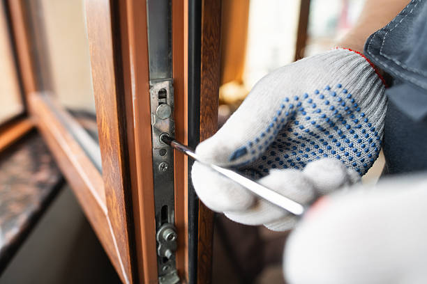 istock Man with screwdriver repairing window 2250704484